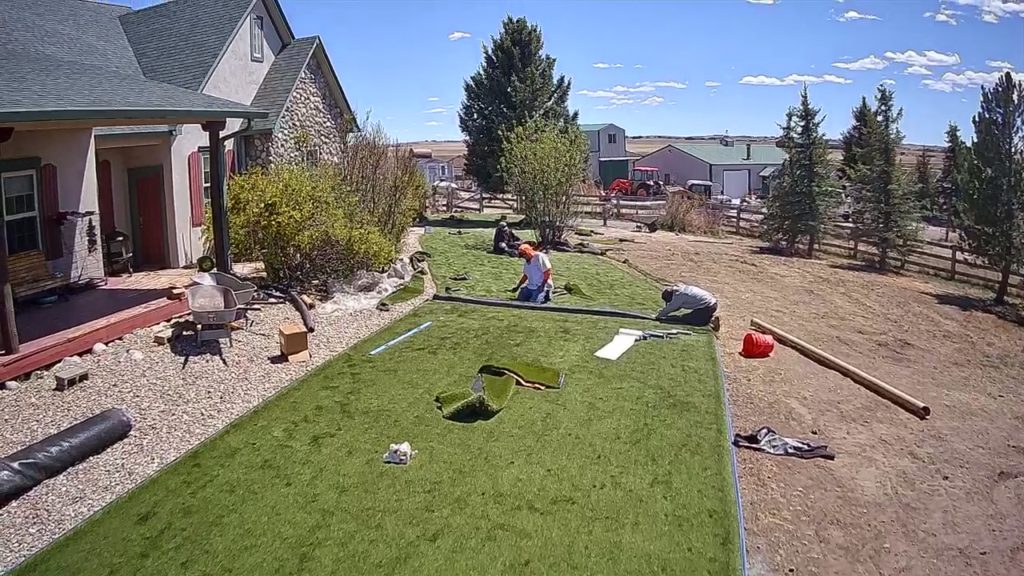 BlueSky workers applying artificial grass