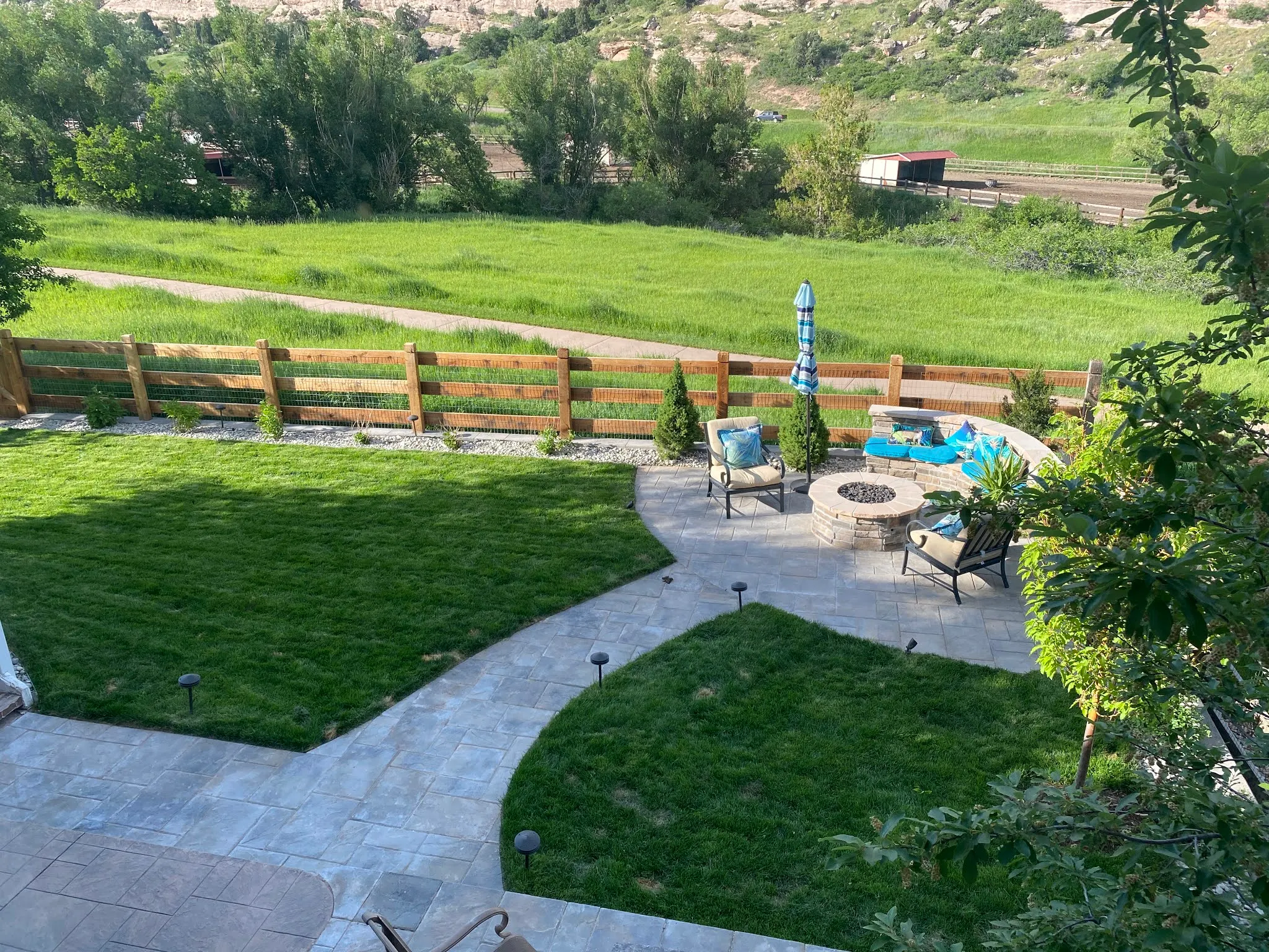 Winding Belgard concrete paver walkway connecting a front yard to a backyard oasis in Castle Rock